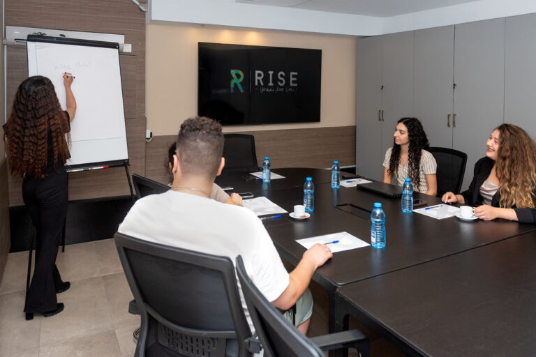 Speaker Presenting Business Chart at Rise Urban Art Hotel